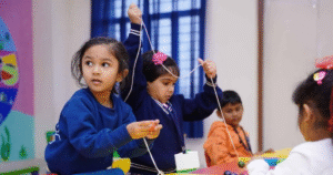 Children learning together in a quality early childhood education classroom at Akshaya Bala Kuteera preschool.
